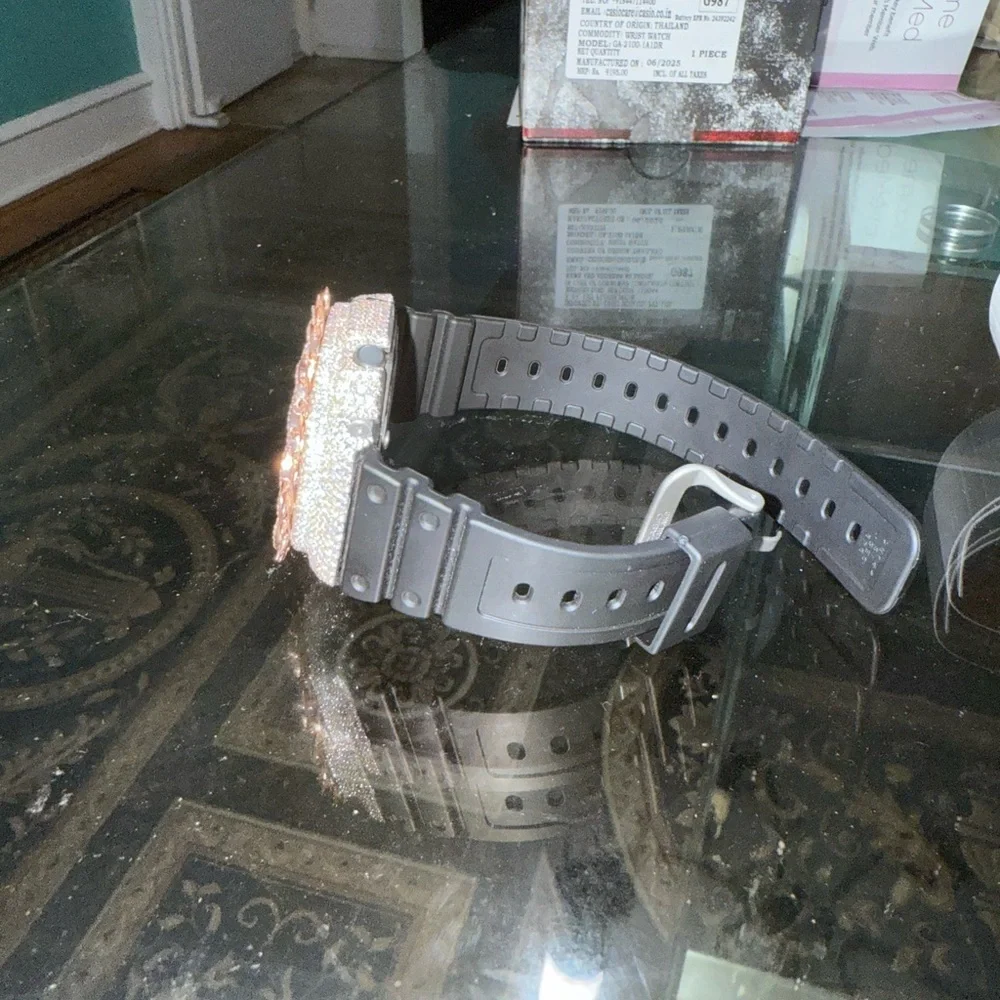 Casio G-Shock Black and Silver Watch with Rose Gold Accents